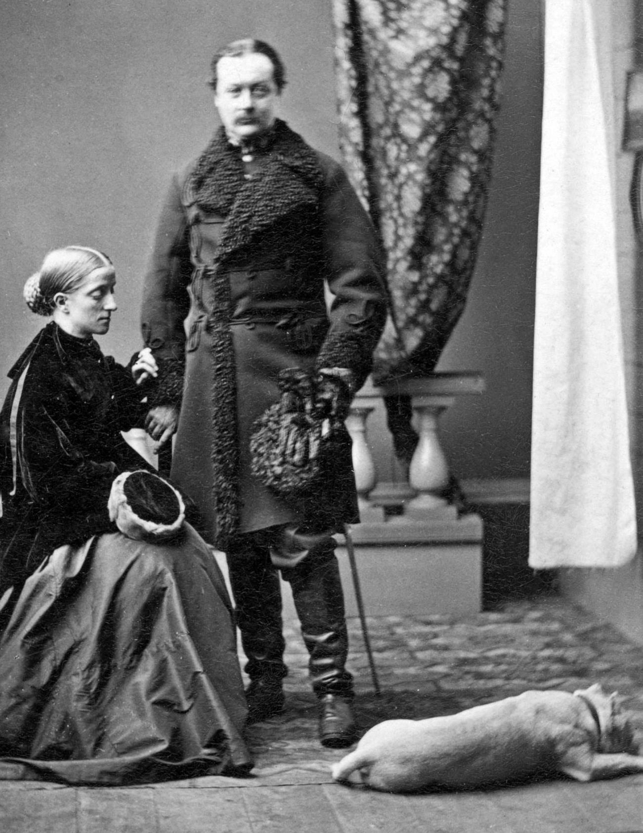 Juliana Horatia Ewing was quite pleased with herself for this photo because Hector the mischievous bulldog behaved himself, despite the cameras of the time requiring the subject to sit very still. Apparently her husband Alexander (who she always called Rex) wasn't quite as able to sit as still because he is a bit blurry. (Provincial Archives of New Brunswick P1-114)