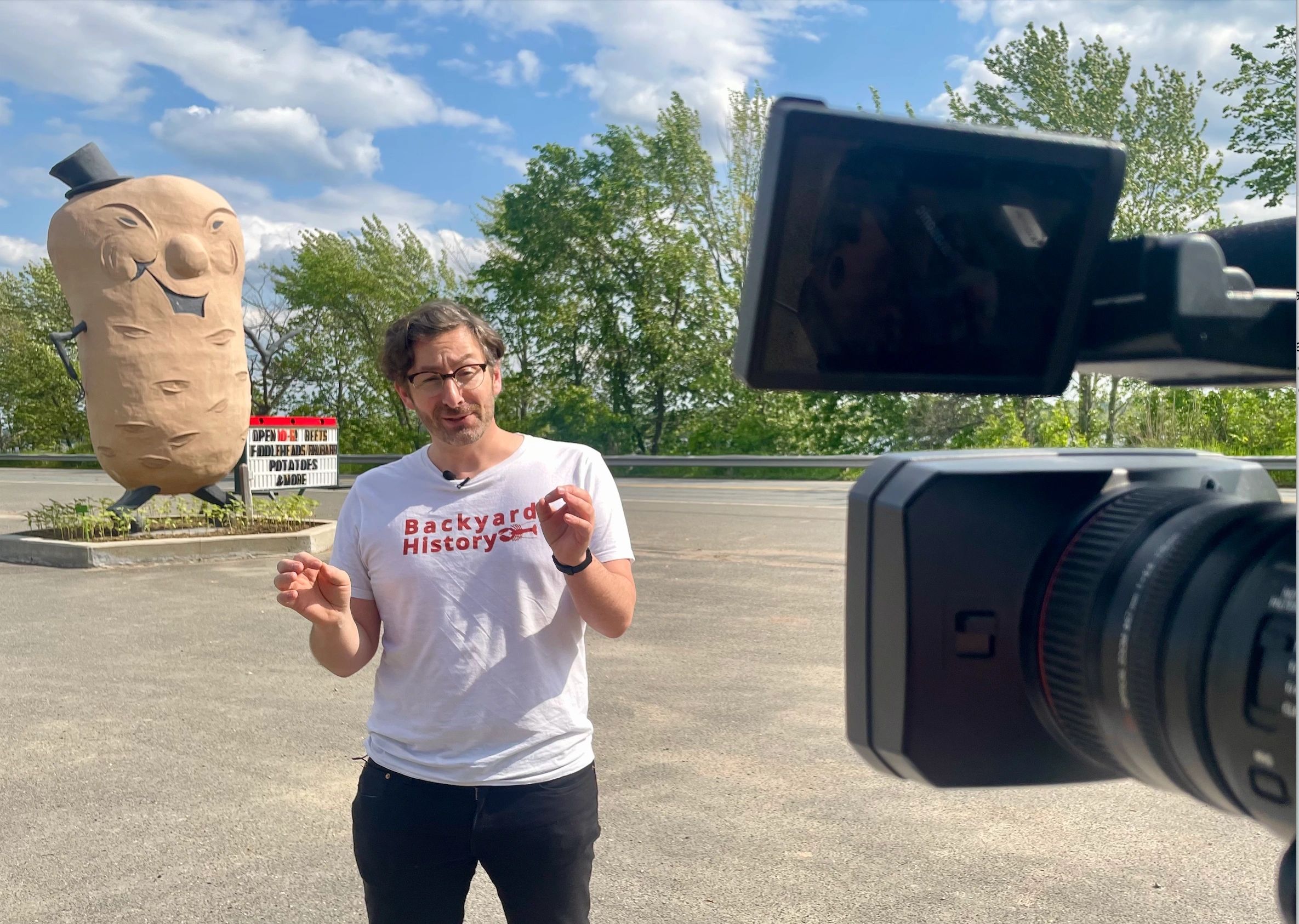 Mr. Potato Man (left) with the author (centre) during a recent CTV interview. When the Big Potato was first unveiled, a horrified local newspaper called it "a monstrous spud." 