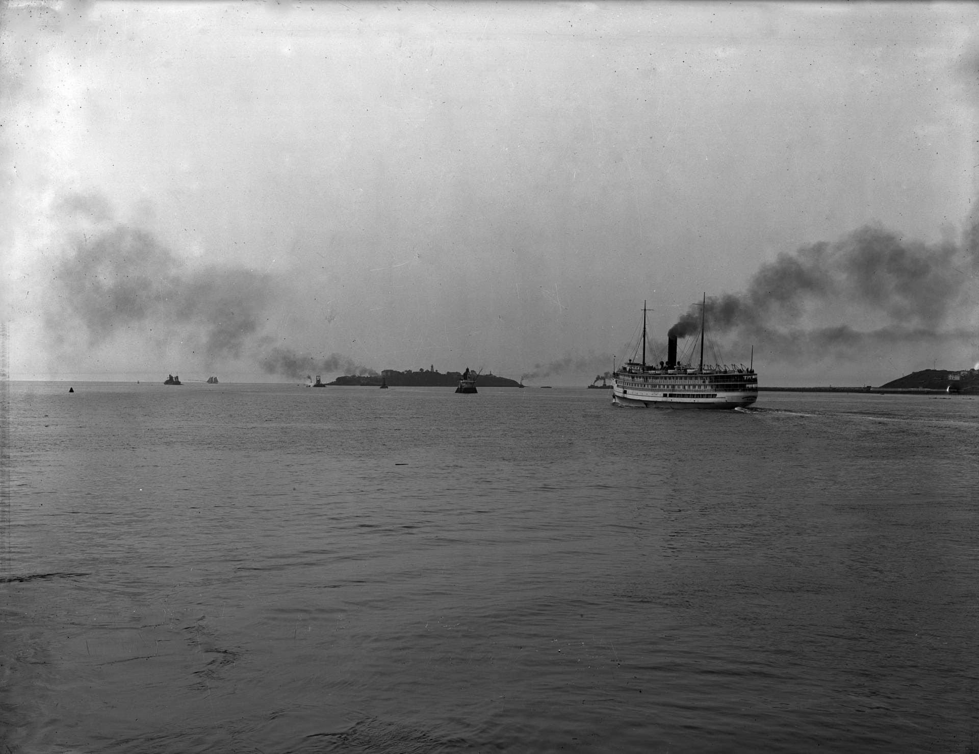 A ship leaving Saint John and passing Partridge Island in the distance. (Provincial Archives of New Brunswick P210-703)